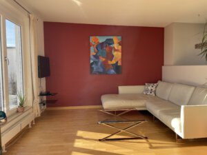 Modern corner sofa with flat screen TV in furnished flat in Munich