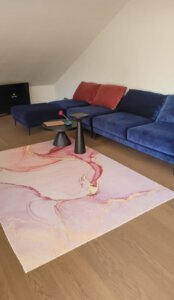 Living room with large couch and TV in furnished apartment in Munich West