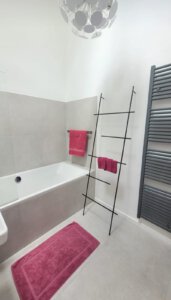 Modern bathroom with bathtub in furnished apartment in Munich West