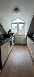 Fitted kitchen with window in furnished apartment in Munich West