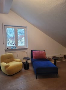 Cosy seating area with designer furniture in furnished apartment in Munich West