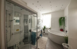 Large wellness bathroom with daylight in furnished flat in Munich South