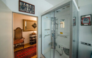 Rain massage shower in bright bathroom in furnished flat in the south of Munich