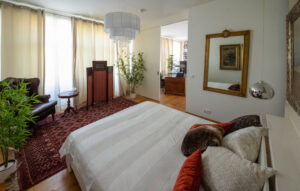 Bedroom with comfortable double bed in a furnished flat in Munich