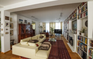 Elegant living room with large corner sofa in a furnished flat in Munich