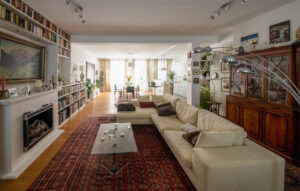 Elegant living room with fireplace in a furnished flat in Munich